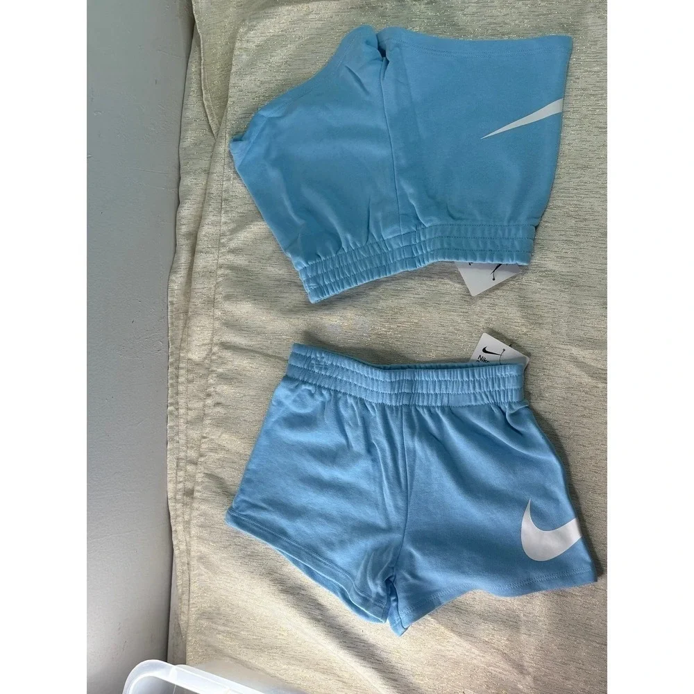 Two pairs of Nike baby blue short size 6